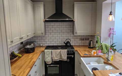 custom kitchen with fitted cooker